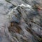 Wavy rippling turbulent water surface of rapids in stream, swelled creek after rain, hydro energy, water torrent