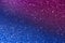 Wavy shimmering blue background. Texture with grain and purple sequins close-up. Gradient two-color image