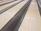 Waxed wooden bowling alley lanes with bumpers