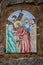 Way of the cross. 5th Station. Simon of Cyrene helps Jesus to carry the cross. Painted ceramic tile, Ingurtosu, Arbus, Sardinia