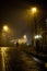 On the way home - single man on the Baklandet foggy streets, night walk in Trondheim`s old town