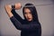 The way of the ninja. Studio portrait of a beautiful young woman in a martial arts outfit wielding a samurai sword.