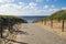 Way to the beach over the cordoned off dunes.