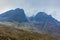 On the way to the Bla Bheinn mountain with a majestic rocky mountain and white altitude clouds