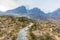 On the way to the Bla Bheinn mountain with a majestic rocky mountain and white altitude clouds