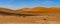 On the way to Deadvlei Ssossusvlei surrounded by great dunes. Red sand. Panoramic view