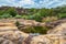 On the way to the rock arch you pass the mirror lagoon of the rocky plateau of Cerro Arco in Tobati