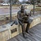 `Wayne Ferguson` by artist David Iles of Bolivar Bronze along the boardwalk of Wayne Ferguson Plaza in Lewisville, Texas.