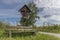 Wayside cross and wooden bench in the Bavarian forest in GrÃ¼b with Grafenau