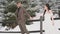 Weakly dressed couple riding in the snow