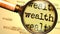 Wealth - magnifying glass enlarging English word Wealth to symbolize taking a closer look, analyzing or searching for an