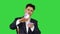 Wealthy businessman throwing money in air on a Green Screen, Chroma Key.