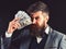 Wealthy and confident. Bearded man with dollar banknotes. Successful businessman hold cash money. Rich man with beard in