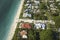 Wealthy neighborhood in small town Boca Grande, Florida with expensive waterfront houses between green palm trees