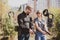 A weapons instructor teaches a girl to shoot a pistol at a firing range