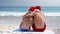 Wear view of couple hugging with santa hat