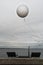 Weather balloon flies on the sea near the haven of Aarhus