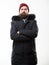 Weather resistant jacket concept. Winter season menswear. Hood adds warmth and weather resistance. Man bearded stand