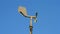 Weather station rotated  on blue sky, climate diversity,