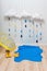Weather symbols. Handmade room decoration clouds with rain drops, puddle, child yellow rubber boots, umbrella and ducks