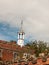 Weather top small white tower top of church hall with england sh