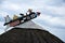 Weather vane of fishermen on the roof top of a house h in Nida,