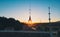 Weather vane on the roof of the castle at sunset