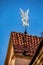 Weather vane showing the fight of St. Nicholas and Lucifer in Vilnius, Lithuania