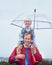 The weather wont stand in our way. Cropped portrait of a father carrying his son on his shoulders outside in the rain.