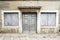 A Weatherbeaten Doorway And Shutters