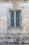 Weathered and Ancient Maltese shuttered window , blue