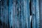 Weathered blue painted wooden planks fence background