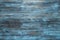 Weathered blue stained wood texture background.