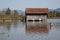 Weathered boat house with wooden boardwalk with bricks at Kochelsee Bavaria Germany