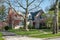 Weathered Brick House in Spring Trees Setting