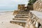 Weathered concrete stairs with mold, faded paint.,crumbling