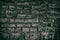 Weathered dark brick wall - retro grungy background