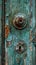 Weathered door with peeling paint and rusty door knob