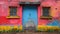 Weathered door and window in a colorful wall.