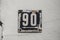 Weathered enamelled plate number 90