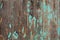 Weathered faded green painted wooden background