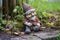 weathered garden gnome missing its head