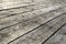 Weathered gray wooden floorboards as background photo