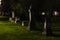 Weathered headstones at night time