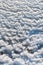 Weathered ice and frozen snow in the form of needle crystals on the bank of the Tiligul Estuary on a sunny day