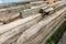 Weathered Memories: Stack of Aged and Decayed Wooden Beams.