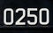 Weathered numbers zero, two, five, 0250, or 0, 2, 5 painted white on a piece of black metal. Abstarct numeral background