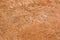 Weathered ochre-colored wall, close-up with copy space