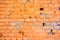 Weathered orange brick wall texture