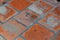 Weathered orange floor tile